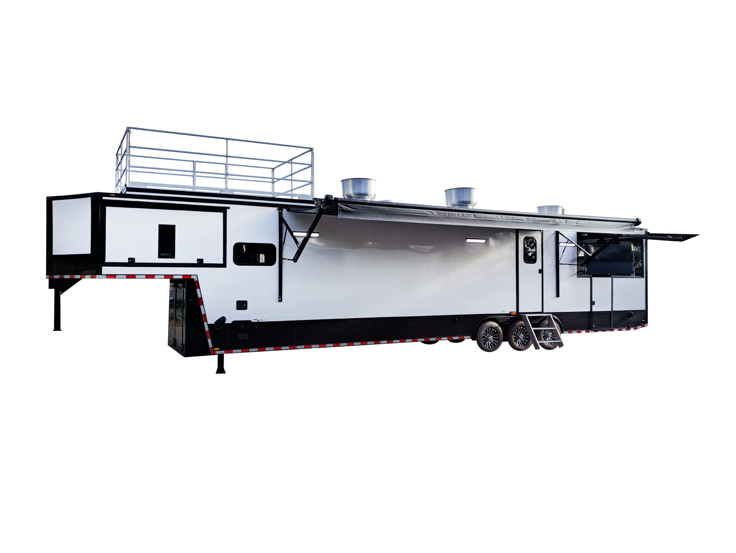 A large, white and black fifth-wheel trailer or custom concession trailer with a rooftop deck and multiple awnings extended, parked on a white background